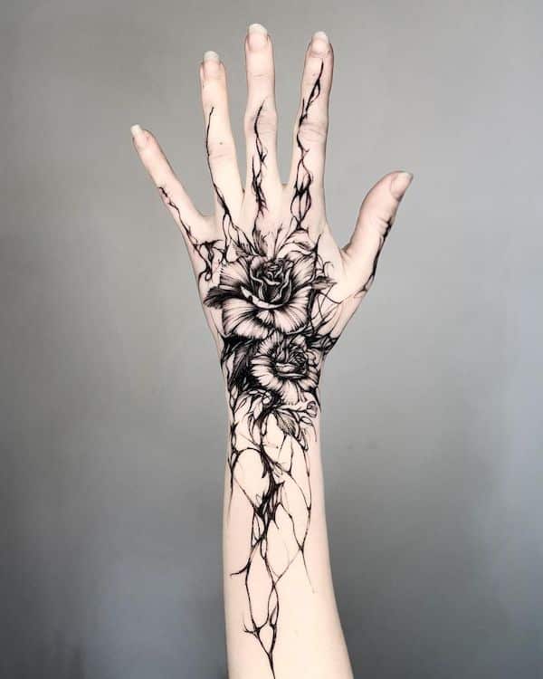 floral tattoos a beautiful way to express yourself through art black rose hand tattoo