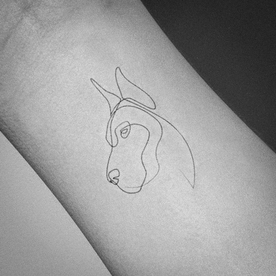 line art tattoos simple, versatile, and affordable dog