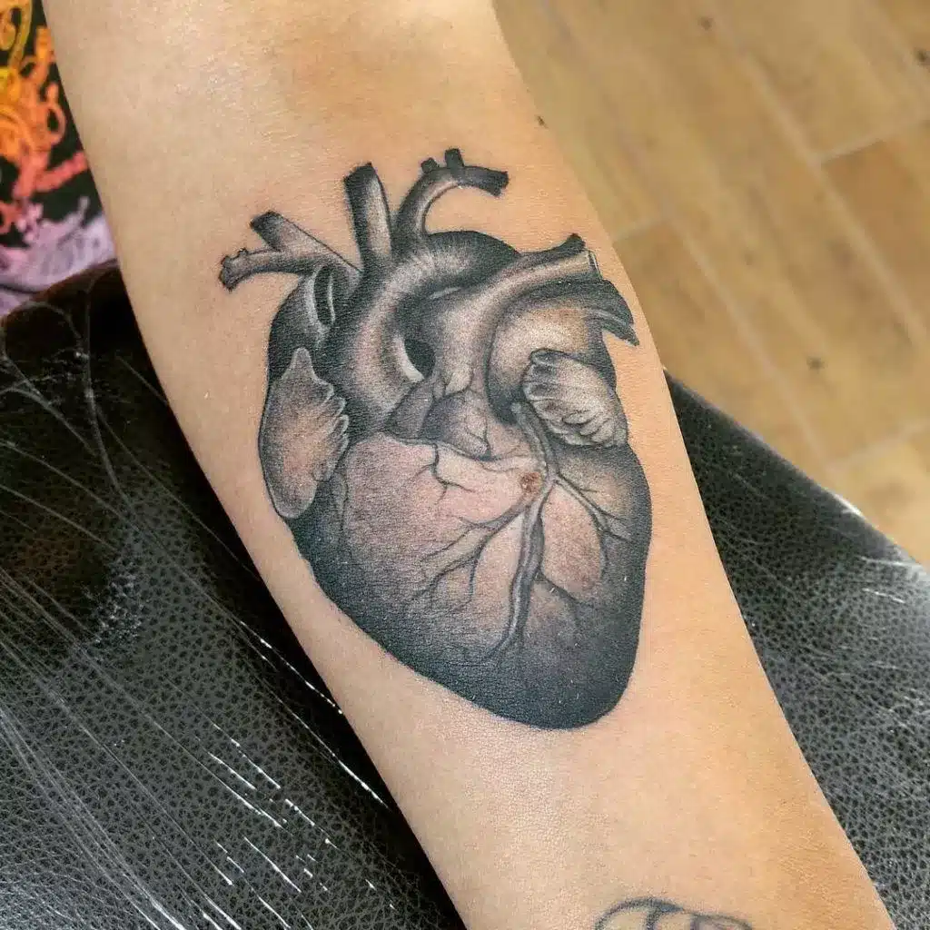 realism tattoo style creating striking and lifelike tattoos heart