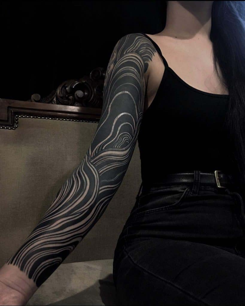 the art of blackwork tattoos history, meanings, and design wavy ornament