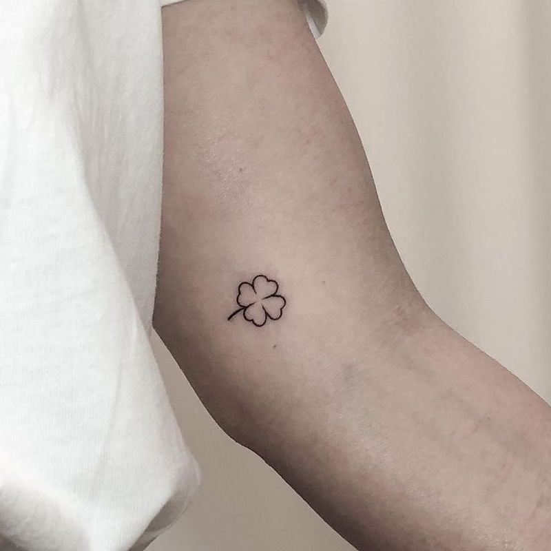 the beauty and meaning of minimalist tattoo style clover