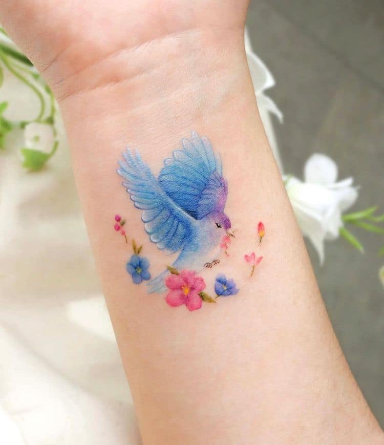 the beauty of watercolor tattoos a unique and artistic style delicate bird